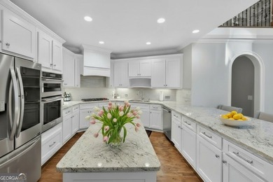 Welcome to your dream home on a quiet cul-de-sac, backing up to on The Golf Club of Georgia in Georgia - for sale on GolfHomes.com, golf home, golf lot