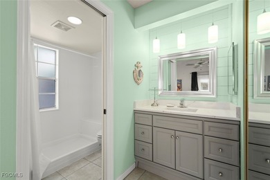 SUNLIGHT POURS IN OFF THE GLISTENING LAKE. Second floor end unit on Gulf Harbour Yacht and Country Club in Florida - for sale on GolfHomes.com, golf home, golf lot