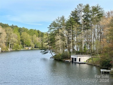 Absolutely magnificent and rare gentle lakefront lot with on Lake Toxaway Country Club in North Carolina - for sale on GolfHomes.com, golf home, golf lot