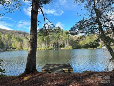 Absolutely magnificent and rare gentle lakefront lot with on Lake Toxaway Country Club in North Carolina - for sale on GolfHomes.com, golf home, golf lot