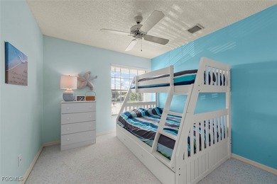 SUNLIGHT POURS IN OFF THE GLISTENING LAKE. Second floor end unit on Gulf Harbour Yacht and Country Club in Florida - for sale on GolfHomes.com, golf home, golf lot