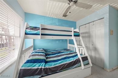 SUNLIGHT POURS IN OFF THE GLISTENING LAKE. Second floor end unit on Gulf Harbour Yacht and Country Club in Florida - for sale on GolfHomes.com, golf home, golf lot