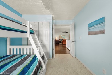 SUNLIGHT POURS IN OFF THE GLISTENING LAKE. Second floor end unit on Gulf Harbour Yacht and Country Club in Florida - for sale on GolfHomes.com, golf home, golf lot