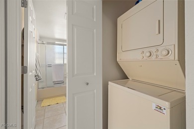 SUNLIGHT POURS IN OFF THE GLISTENING LAKE. Second floor end unit on Gulf Harbour Yacht and Country Club in Florida - for sale on GolfHomes.com, golf home, golf lot