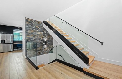 Welcome to this stunning, fully furnished modern residence on Eco Golf Club in Florida - for sale on GolfHomes.com, golf home, golf lot