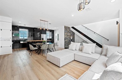 Welcome to this stunning, fully furnished modern residence on Eco Golf Club in Florida - for sale on GolfHomes.com, golf home, golf lot