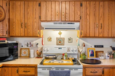 Charming 3-bedroom, 2-bath log home located in the heart of on Woodstone Meadows Golf Course At Massanutten in Virginia - for sale on GolfHomes.com, golf home, golf lot