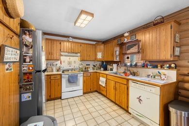 Charming 3-bedroom, 2-bath log home located in the heart of on Woodstone Meadows Golf Course At Massanutten in Virginia - for sale on GolfHomes.com, golf home, golf lot