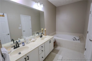 Welcome to this charming ranch home in the highly sought-after on Gates Four Golf and Country Club in North Carolina - for sale on GolfHomes.com, golf home, golf lot