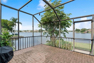 Enjoy breathtaking lakefront views  spectacular sunsets from on Pembroke Lakes Golf Club in Florida - for sale on GolfHomes.com, golf home, golf lot