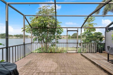 Enjoy breathtaking lakefront views  spectacular sunsets from on Pembroke Lakes Golf Club in Florida - for sale on GolfHomes.com, golf home, golf lot