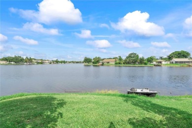 Enjoy breathtaking lakefront views  spectacular sunsets from on Pembroke Lakes Golf Club in Florida - for sale on GolfHomes.com, golf home, golf lot