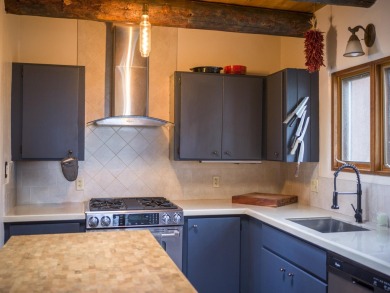 Discover unparalleled beauty and comfort in this exquisite on Taos Country Club in New Mexico - for sale on GolfHomes.com, golf home, golf lot