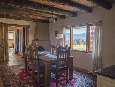 Discover unparalleled beauty and comfort in this exquisite on Taos Country Club in New Mexico - for sale on GolfHomes.com, golf home, golf lot