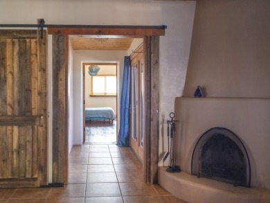 Discover unparalleled beauty and comfort in this exquisite on Taos Country Club in New Mexico - for sale on GolfHomes.com, golf home, golf lot