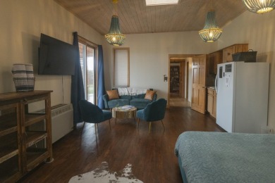 Discover unparalleled beauty and comfort in this exquisite on Taos Country Club in New Mexico - for sale on GolfHomes.com, golf home, golf lot
