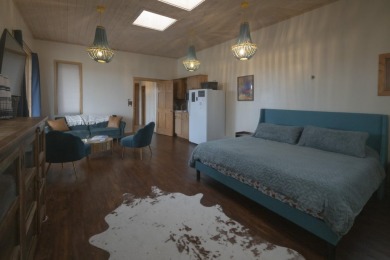 Discover unparalleled beauty and comfort in this exquisite on Taos Country Club in New Mexico - for sale on GolfHomes.com, golf home, golf lot