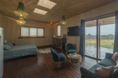 Discover unparalleled beauty and comfort in this exquisite on Taos Country Club in New Mexico - for sale on GolfHomes.com, golf home, golf lot