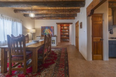 Discover unparalleled beauty and comfort in this exquisite on Taos Country Club in New Mexico - for sale on GolfHomes.com, golf home, golf lot
