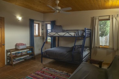 Discover unparalleled beauty and comfort in this exquisite on Taos Country Club in New Mexico - for sale on GolfHomes.com, golf home, golf lot