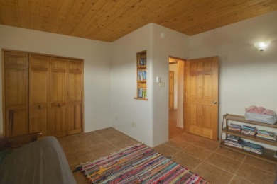 Discover unparalleled beauty and comfort in this exquisite on Taos Country Club in New Mexico - for sale on GolfHomes.com, golf home, golf lot