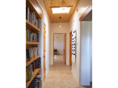 Discover unparalleled beauty and comfort in this exquisite on Taos Country Club in New Mexico - for sale on GolfHomes.com, golf home, golf lot