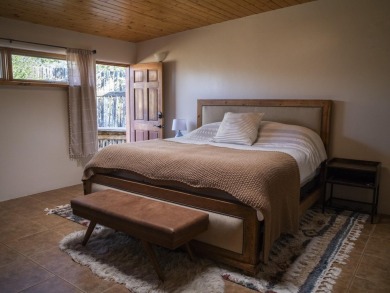 Discover unparalleled beauty and comfort in this exquisite on Taos Country Club in New Mexico - for sale on GolfHomes.com, golf home, golf lot