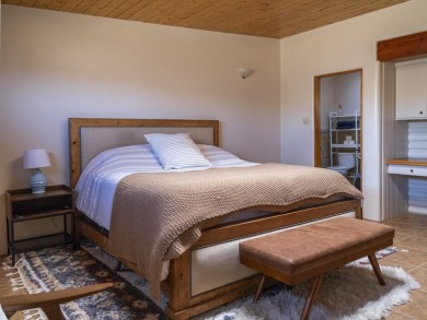Discover unparalleled beauty and comfort in this exquisite on Taos Country Club in New Mexico - for sale on GolfHomes.com, golf home, golf lot