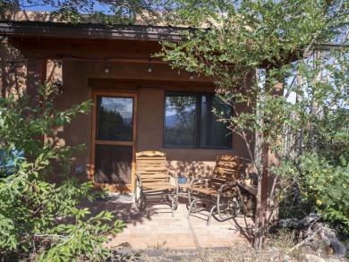 Discover unparalleled beauty and comfort in this exquisite on Taos Country Club in New Mexico - for sale on GolfHomes.com, golf home, golf lot