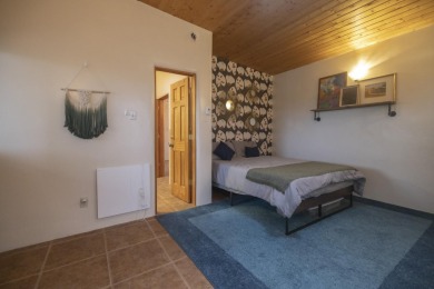 Discover unparalleled beauty and comfort in this exquisite on Taos Country Club in New Mexico - for sale on GolfHomes.com, golf home, golf lot