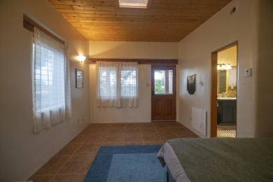 Discover unparalleled beauty and comfort in this exquisite on Taos Country Club in New Mexico - for sale on GolfHomes.com, golf home, golf lot