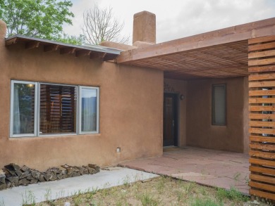 Discover unparalleled beauty and comfort in this exquisite on Taos Country Club in New Mexico - for sale on GolfHomes.com, golf home, golf lot