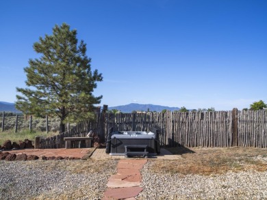 Discover unparalleled beauty and comfort in this exquisite on Taos Country Club in New Mexico - for sale on GolfHomes.com, golf home, golf lot