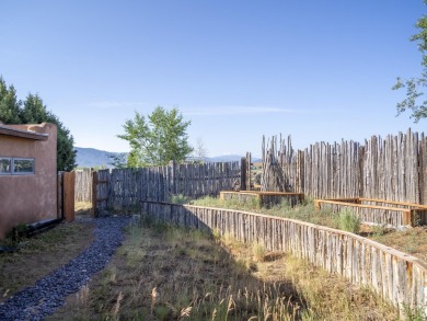 Discover unparalleled beauty and comfort in this exquisite on Taos Country Club in New Mexico - for sale on GolfHomes.com, golf home, golf lot