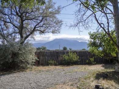 Discover unparalleled beauty and comfort in this exquisite on Taos Country Club in New Mexico - for sale on GolfHomes.com, golf home, golf lot