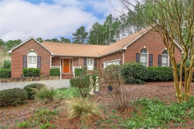 Charming all-brick home located in the gated and golf community on Carolina Trace Country Club in North Carolina - for sale on GolfHomes.com, golf home, golf lot