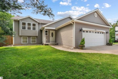 Welcome to this spacious 3-bedroom, 2-bath walkout home on on Bay Meadows Golf Course - Executive in Michigan - for sale on GolfHomes.com, golf home, golf lot