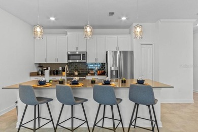 Unlock the door to luxury resort living and Central Florida on The Oasis Club at Champions Gate in Florida - for sale on GolfHomes.com, golf home, golf lot