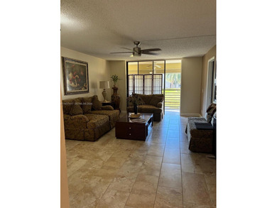 Elevated living meets total convenience in this charming on Sunrise Lakes Phase IV Golf Course in Florida - for sale on GolfHomes.com, golf home, golf lot