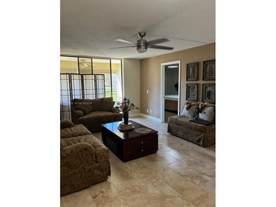 Elevated living meets total convenience in this charming on Sunrise Lakes Phase IV Golf Course in Florida - for sale on GolfHomes.com, golf home, golf lot