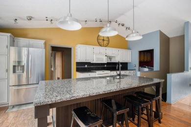 This spacious home has panoramic views of the 14th hole on on Lake Doster Golf Club in Michigan - for sale on GolfHomes.com, golf home, golf lot