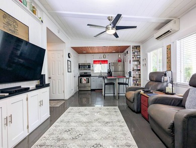 Park your RV under this 40'x20' port with 592 sq.ft. living area on The Great Outdoors Golf and Country Club in Florida - for sale on GolfHomes.com, golf home, golf lot