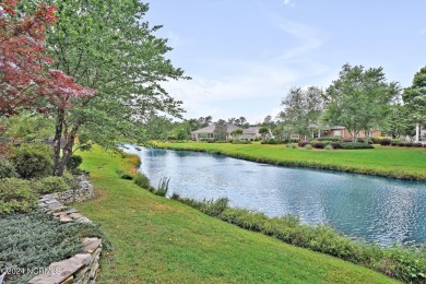 Escape to an oasis on the water with golf course views in the on Magnolia Greens Golf Plantation in North Carolina - for sale on GolfHomes.com, golf home, golf lot