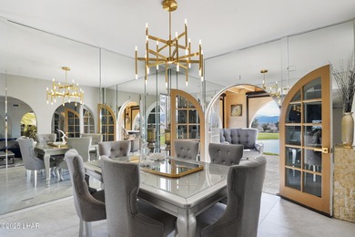 Discover luxury living with stunning mountain, lake, pond, and on London Bridge Golf Course in Arizona - for sale on GolfHomes.com, golf home, golf lot