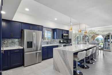 Discover luxury living with stunning mountain, lake, pond, and on London Bridge Golf Course in Arizona - for sale on GolfHomes.com, golf home, golf lot