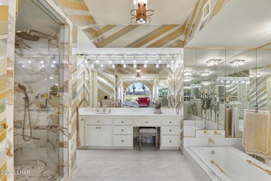 Discover luxury living with stunning mountain, lake, pond, and on London Bridge Golf Course in Arizona - for sale on GolfHomes.com, golf home, golf lot