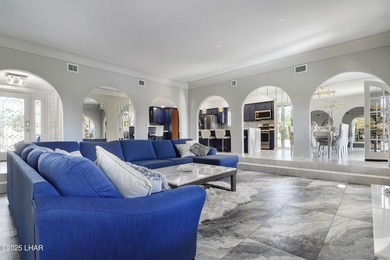 Discover luxury living with stunning mountain, lake, pond, and on London Bridge Golf Course in Arizona - for sale on GolfHomes.com, golf home, golf lot