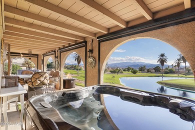 Discover luxury living with stunning mountain, lake, pond, and on London Bridge Golf Course in Arizona - for sale on GolfHomes.com, golf home, golf lot