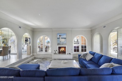 Discover luxury living with stunning mountain, lake, pond, and on London Bridge Golf Course in Arizona - for sale on GolfHomes.com, golf home, golf lot