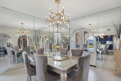 Discover luxury living with stunning mountain, lake, pond, and on London Bridge Golf Course in Arizona - for sale on GolfHomes.com, golf home, golf lot